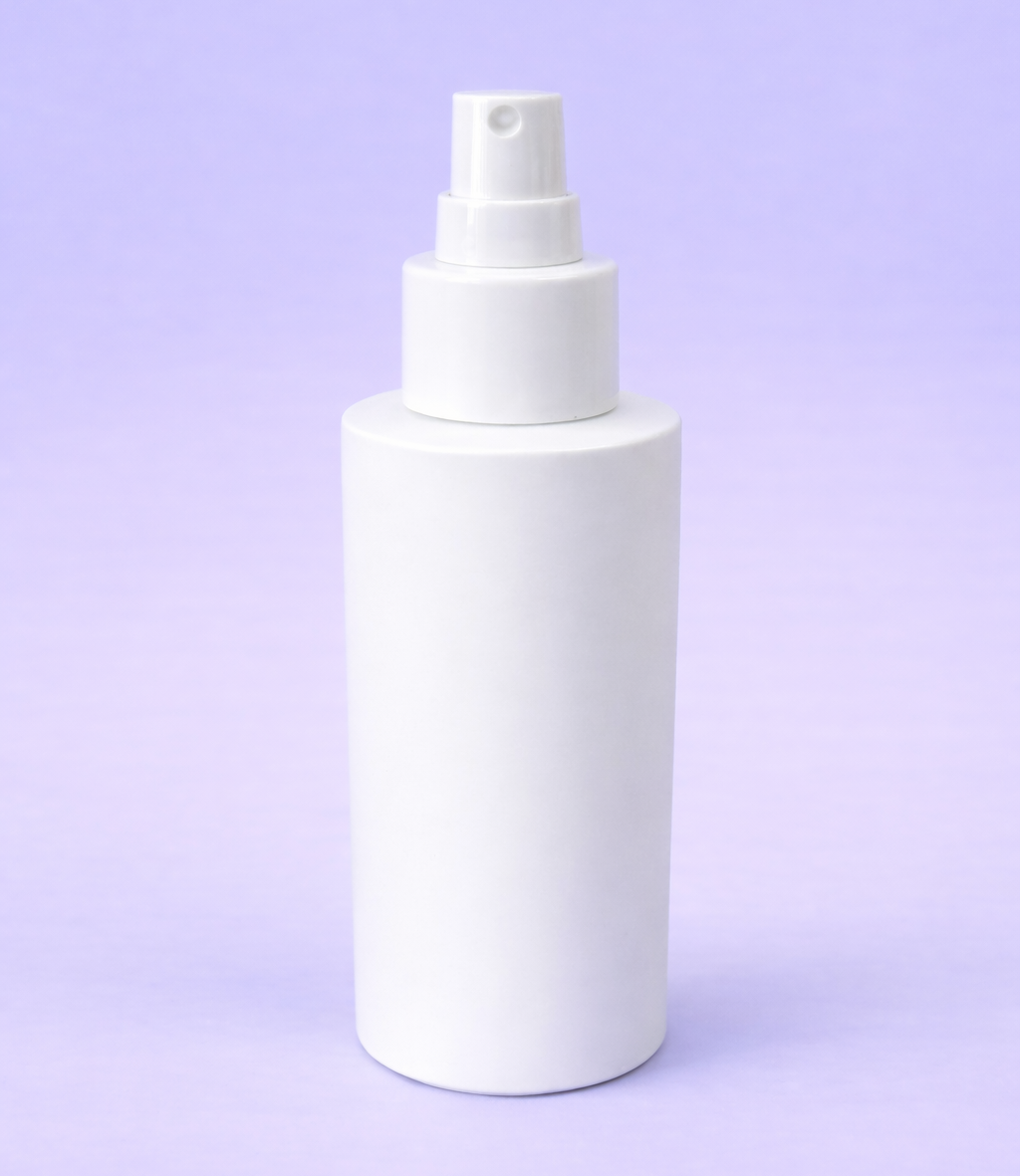 White spray bottle on a light purple background