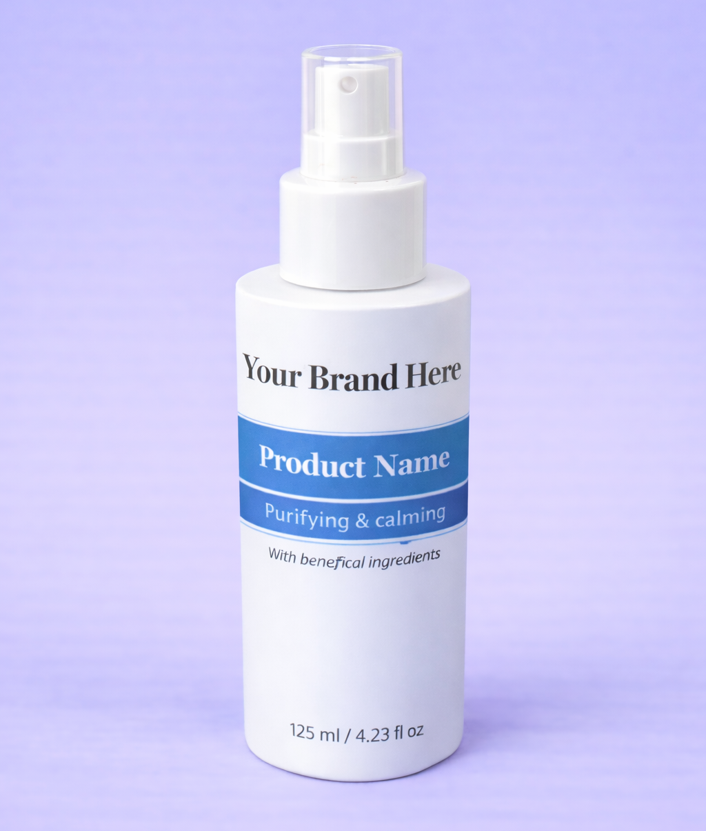 White spray bottle with a blue label on a purple background