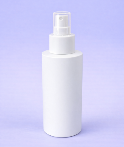 White spray bottle on a light purple background