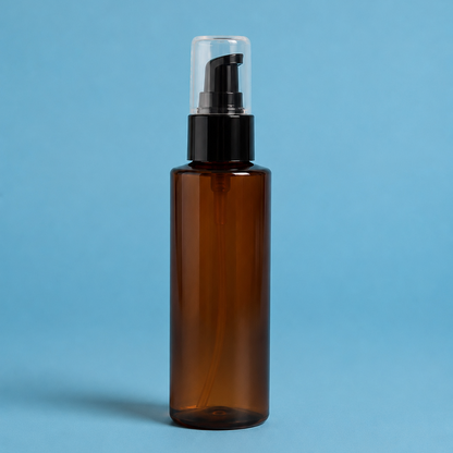 Brown spray bottle with black pump on a blue background