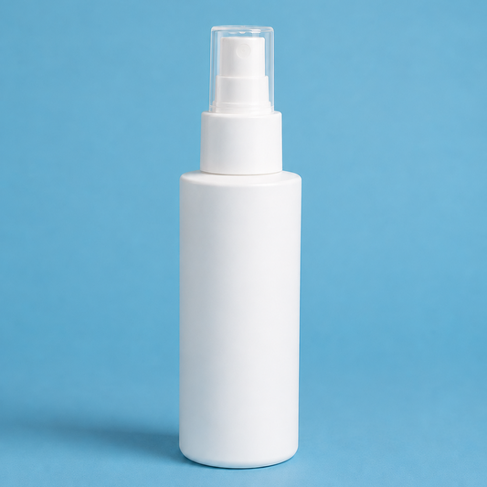 White spray bottle on a blue background